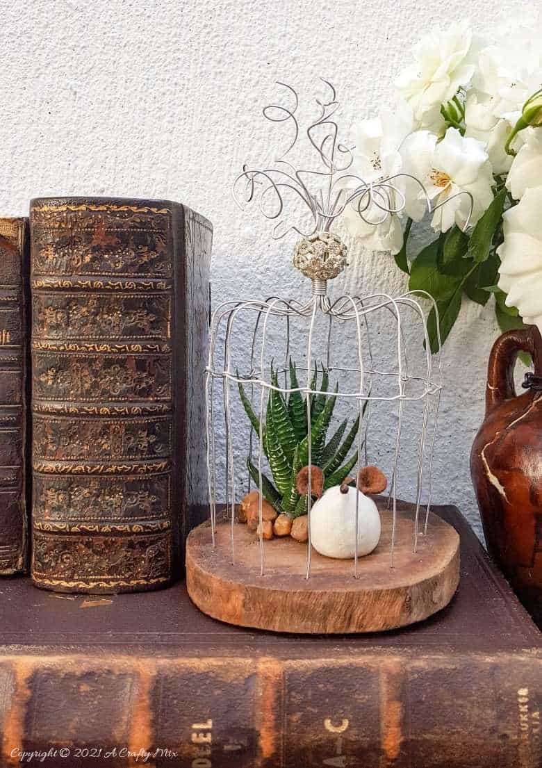 This easy to follow tutorial will show you how to make your own art deco wire bird cage. Made in a morning, it’s a fun way to add a little handcrafted glamour to you décor. #BirdCage #DIY #ACraftyMix