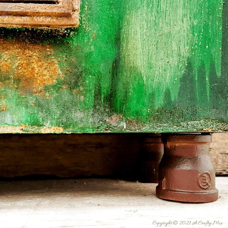 Ever found a cheap melamine cupboard at the thrift store that was just to &ldquo;bleh&rdquo; to fit into your d&eacute;cor style? This tutorial will show you how to give it an easy faux distressed metal makeover that won&rsquo;t break the bank. #melaminmakeover #paintingmelamine #acraftymix #fauxmetal #UnicornSpit
