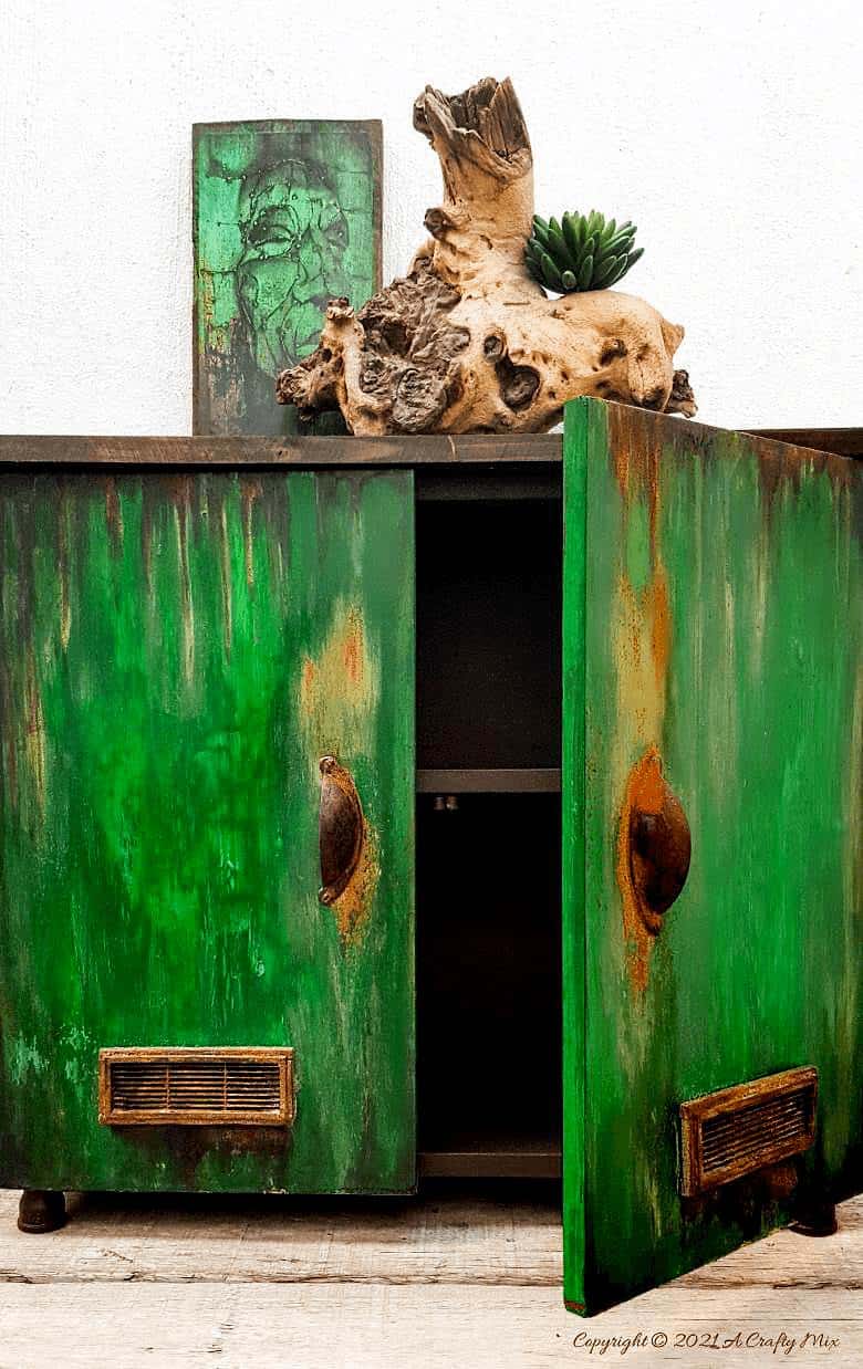 Ever found a cheap melamine cupboard at the thrift store that was just to &ldquo;bleh&rdquo; to fit into your d&eacute;cor style? This tutorial will show you how to give it an easy faux distressed metal makeover that won&rsquo;t break the bank. #melaminmakeover #paintingmelamine #acraftymix #fauxmetal #UnicornSpit