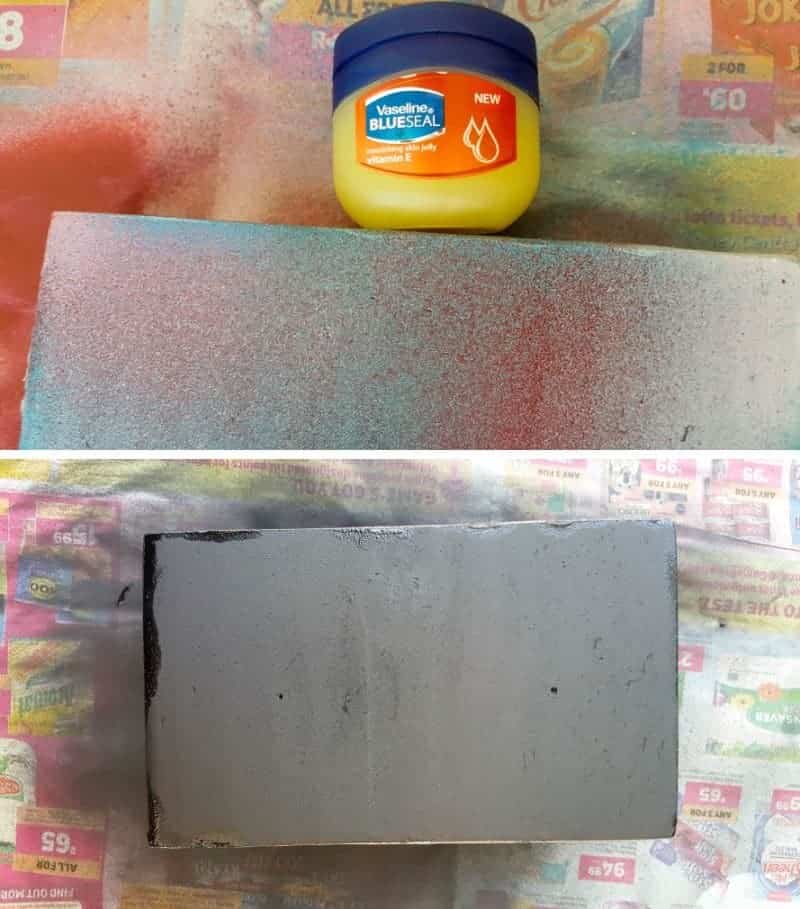 Rub a little petroleum jelly along the edges of the platform and spray black.