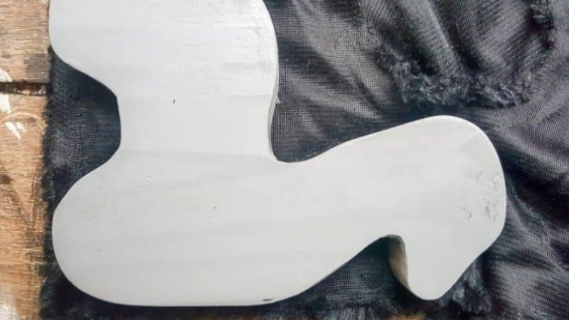 Using the llama as a guide cut out fur fabric that's about 1/2" or 1 cm wider than the llama pull toy