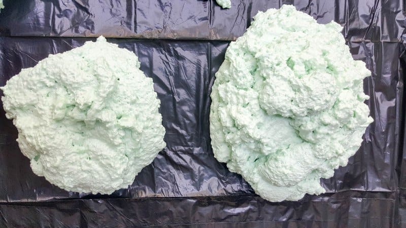 Protect your work are with a plastic sheet and spray two blobs of expanding foam