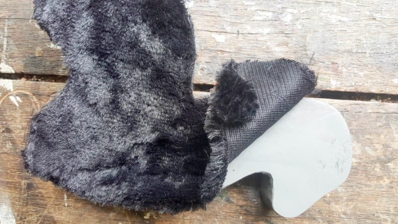 Using the llama as a guide cut out fur fabric that's about 1/2" or 1 cm wider than the llama pull toy
