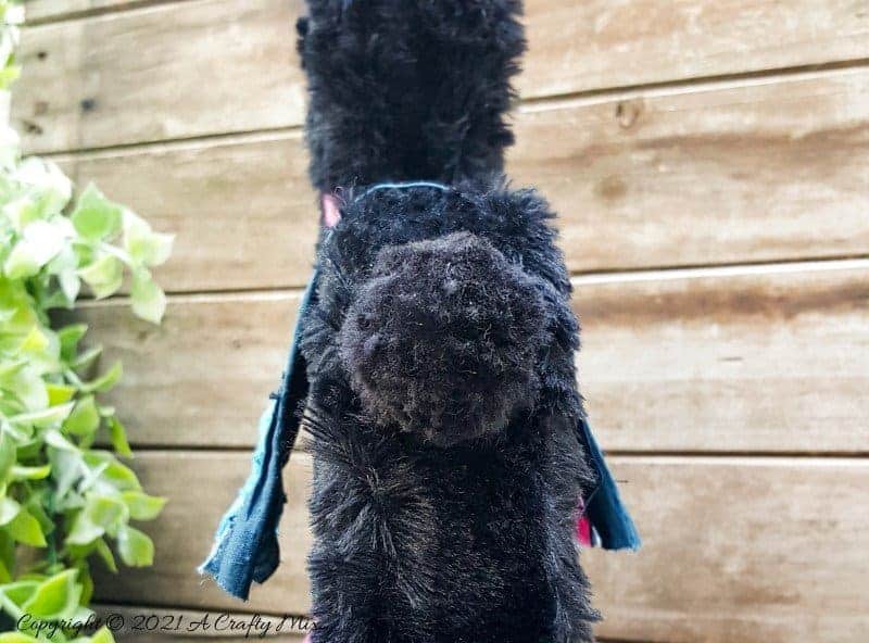 In the tradition of old toys we made this DIY Pull Toy llama using upcycled tin can wheels. This fun recycled craft idea comes with a free printable llama template. #Upcycle #TinCan #ACraftyMix #PullToy #HomeDecor