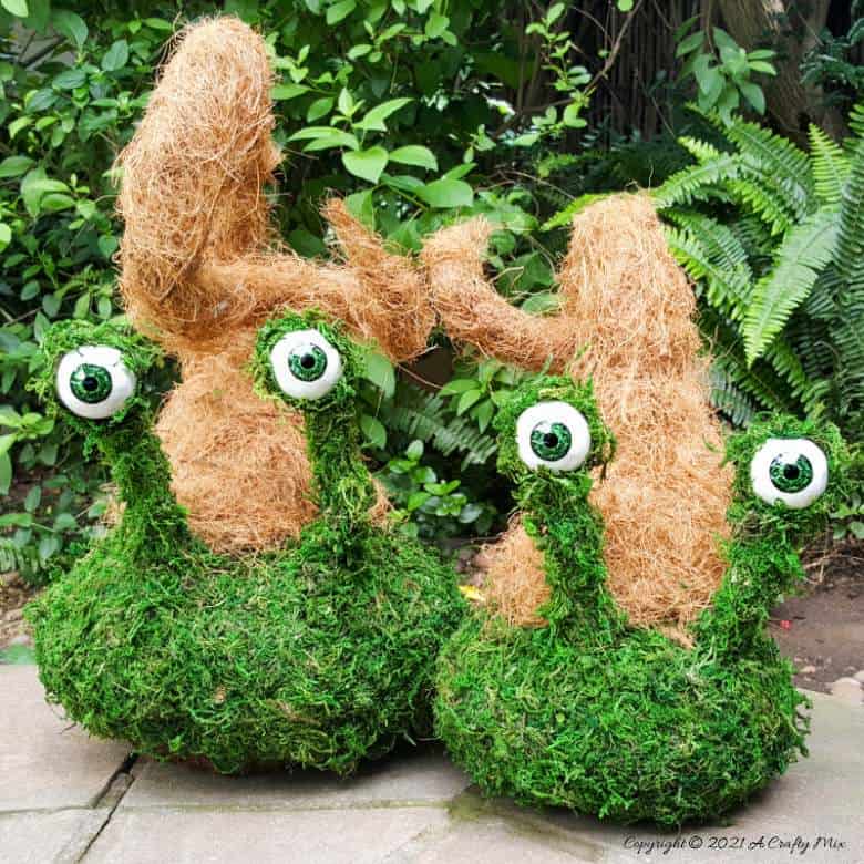 Add a little light-hearted fun to you porch décor with these easy to make mossy creatures. With bendable caps and popping eyes they’re sure to put a smile on your face. #PorchDecor #MossCreatures #ACraftyMix