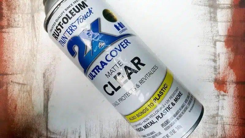 Seal the distressed ink with a clear matt sealer to prevent smudging