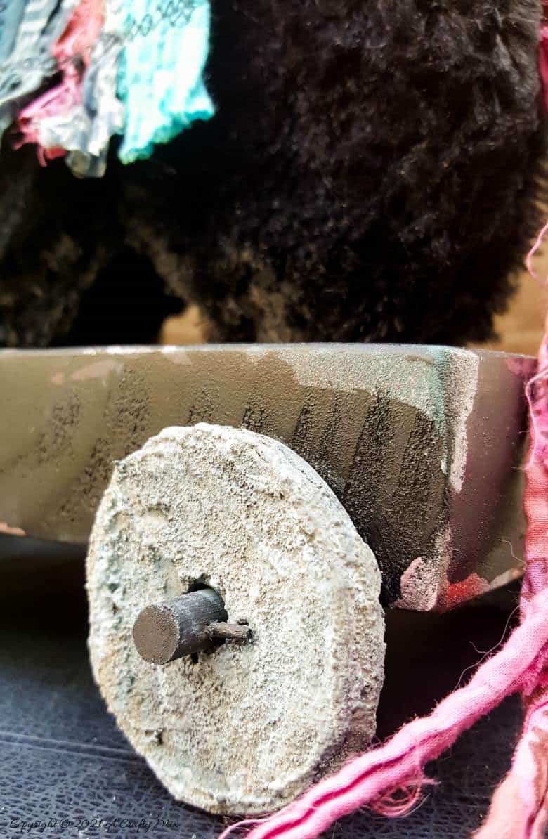 In the tradition of old toys we made this DIY Pull Toy llama using upcycled tin can wheels. This fun recycled craft idea comes with a free printable llama template. #Upcycle #TinCan #ACraftyMix #PullToy #HomeDecor