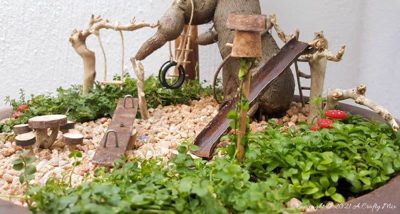 This photo-rich tutorial will show you how you can make your own fairy playground using what you have in your craft cupboard. No fancy tools needed and everything can be made in a morning #FairyGarden, #ACraftyMix, #Playground