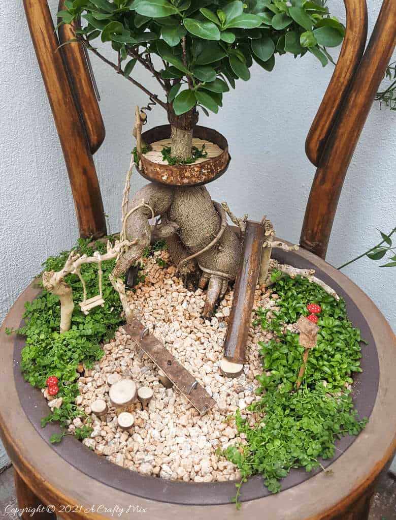 This photo-rich tutorial will show you how you can make your own fairy playground using what you have in your craft cupboard. No fancy tools needed and everything can be made in a morning #FairyGarden, #ACraftyMix, #Playground