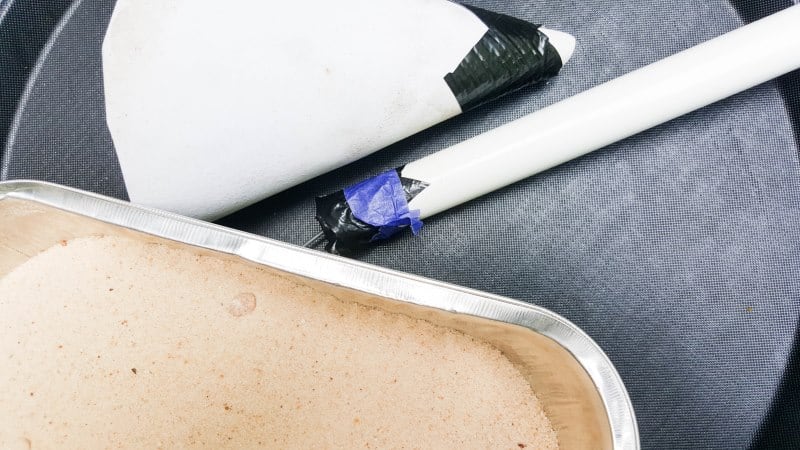 Insert baling wire into the PVC pipe and seal one end