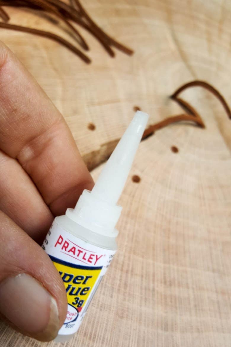 Use glue with a fine applicator tip and add a few drops inside the hole