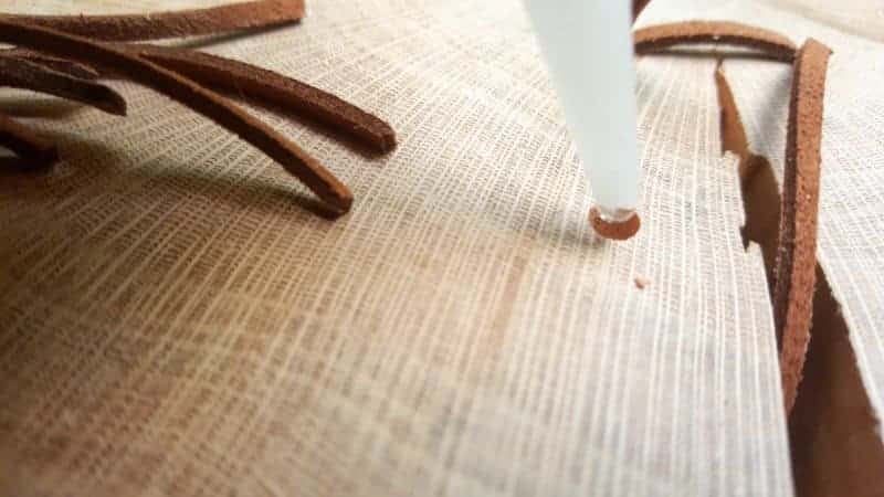 Use glue with a fine applicator tip and add a few drops inside the hole