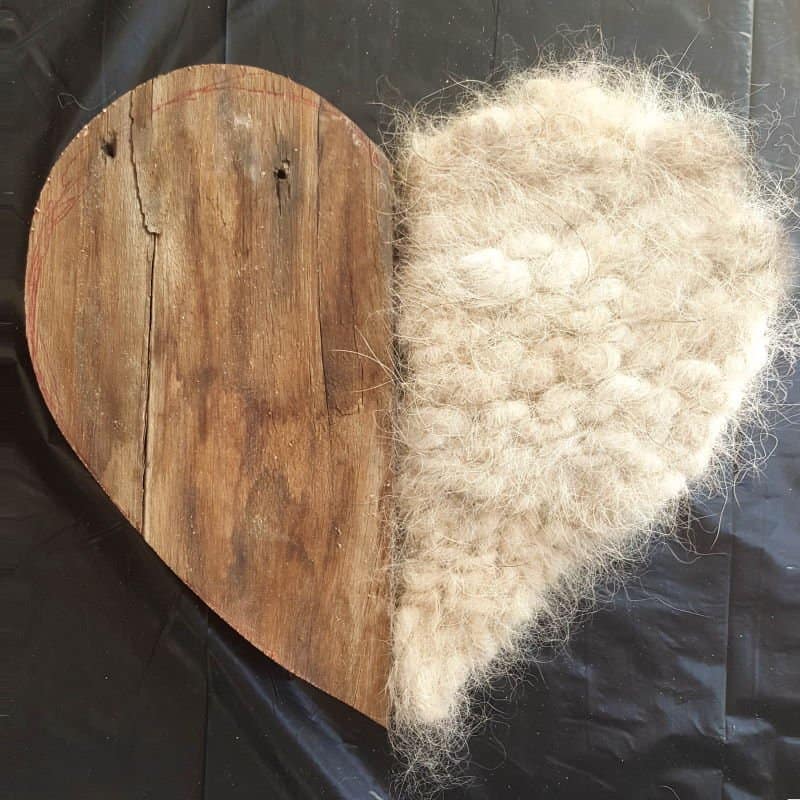 Our dogs shed a lot but instead of cursing them, I decided to make a spun pet hair heart using all the fur that our babies discard so lovingly all over our home. This tutorial will show you how you can turn your fur baby's shed hair into a precious keepsake and includes a video tutorial that will show you how to comb and spin pet hair. #PetCrafts #ACraftyMix #PetKeepsake