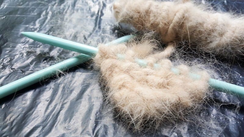 Use the spun pet hair to knit a heart, or in my case 1/2 heart