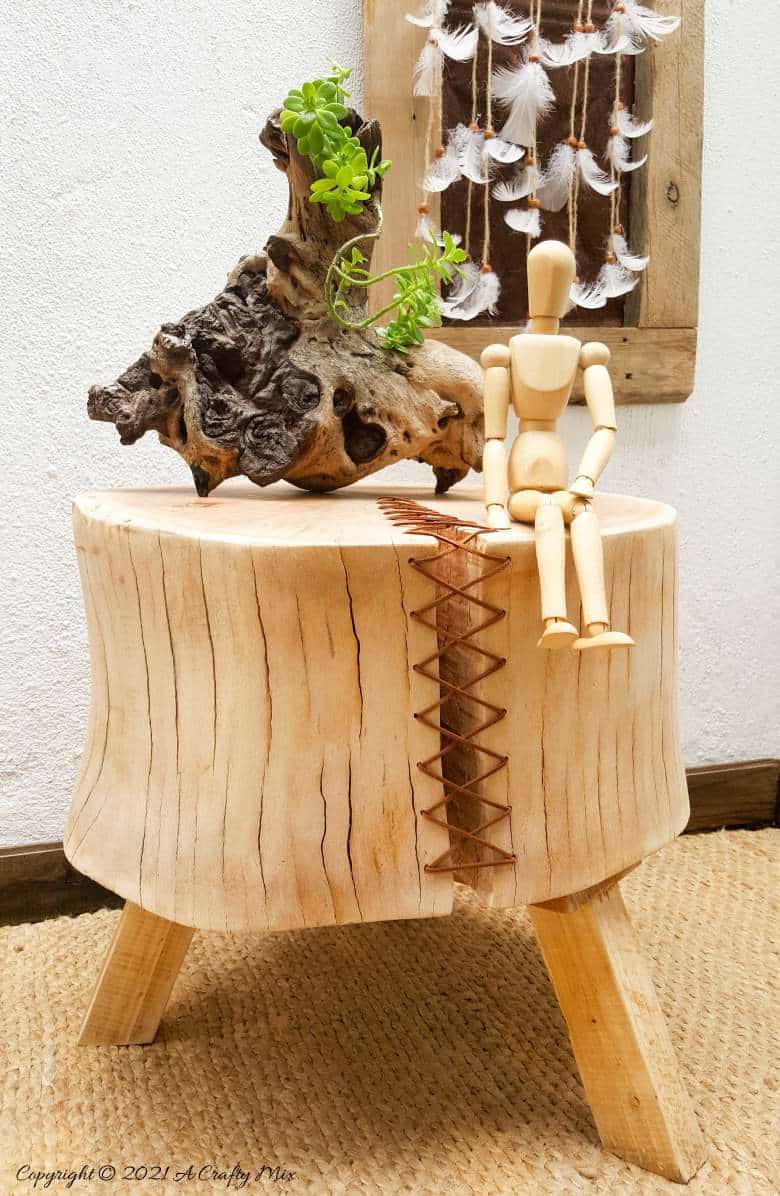 Do you have a gorgeous chunk of wood that&rsquo;s developed a HUGE crack? Don't toss it out until you've seen how easy it is to turn a cracked wooden stump into a d&eacute;cor worthy feature. #HomeDecor #ACraftyMix #CrackedWood
