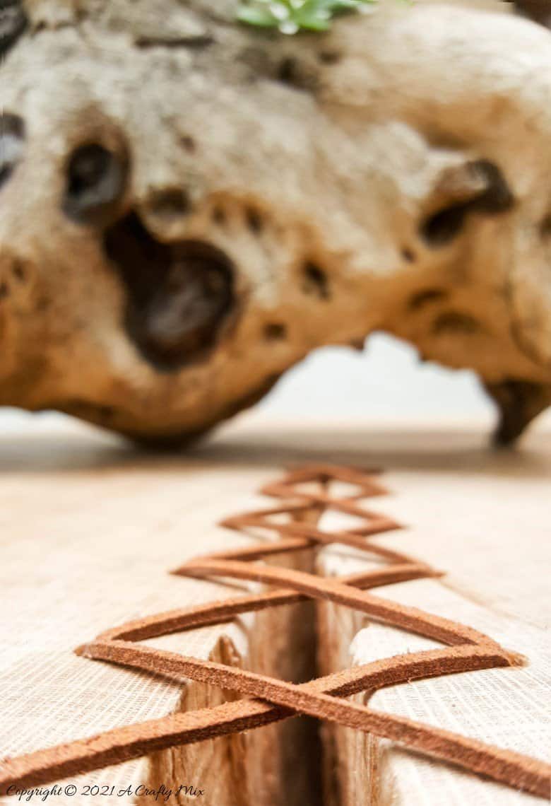 Do you have a gorgeous chunk of wood that&rsquo;s developed a HUGE crack? Don't toss it out until you've seen how easy it is to turn a cracked wooden stump into a d&eacute;cor worthy feature. #HomeDecor #ACraftyMix #CrackedWood