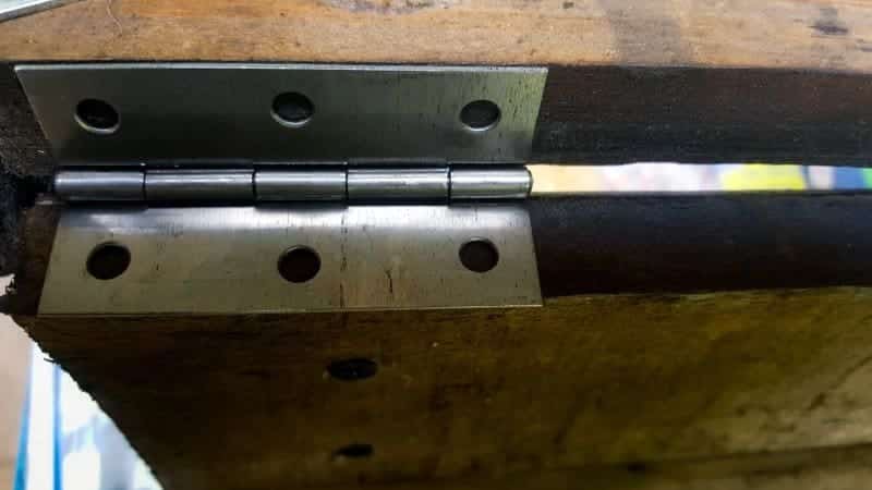 Add a hinge to attach the shutters to the frame