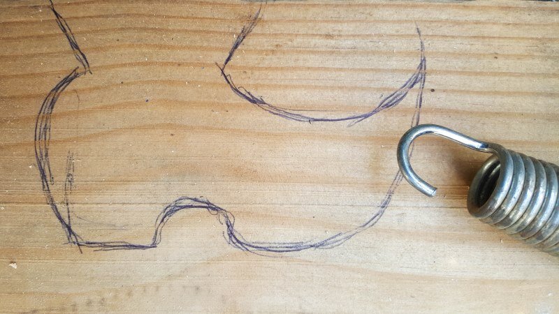 Make a rough sketch of some shoes on a piece of wood and cut out with a jigsaw