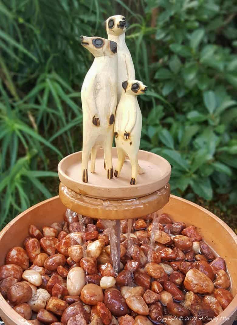 This photo-rich tutorial will show you how just how easy it is to repurpose an empty CD case and turn it in a CD spindle water feature bringing a calming, zen-like decorative feel to any space. #Spindlerepurpose #ACraftyMix #waterfeature
