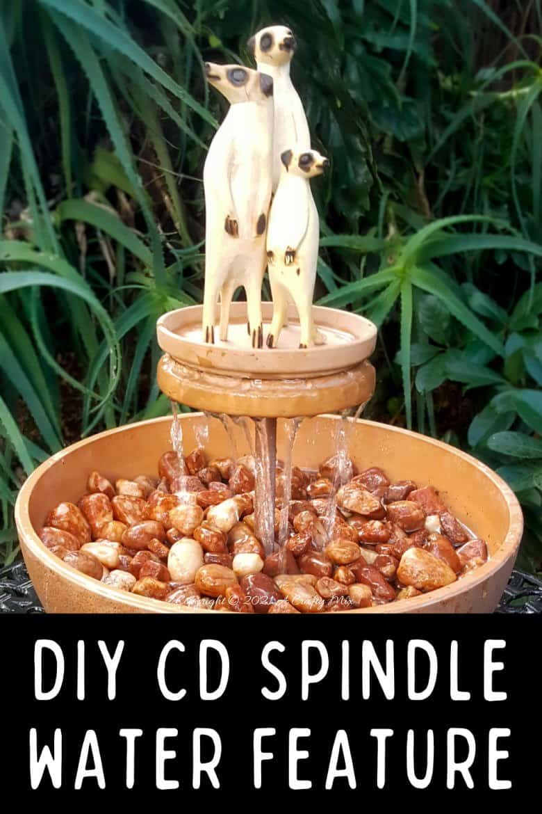 This photo-rich tutorial will show you how just how easy it is to repurpose an empty CD case and turn it in a CD spindle water feature bringing a calming, zen-like decorative feel to any space. #Spindlerepurpose #ACraftyMix #waterfeature