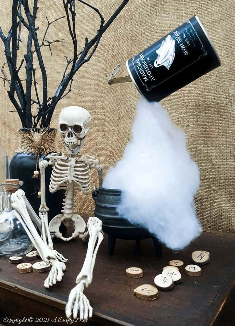 Add a little fun and mystery to your Halloween decor with this easy-to-make magical floating tin can filled with ghost breath. You don't need any special tools and it takes less than an hour to make too. #HalloweenDecor #HalloweenCrafts #ACraftyMix #FloatingTinCan
