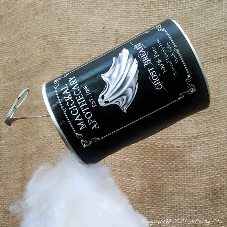 Add a little fun and mystery to your Halloween decor with this easy-to-make magical floating tin can filled with ghost breath. You don't need any special tools and it takes less than an hour to make too. #HalloweenDecor #HalloweenCrafts #ACraftyMix #FloatingTinCan