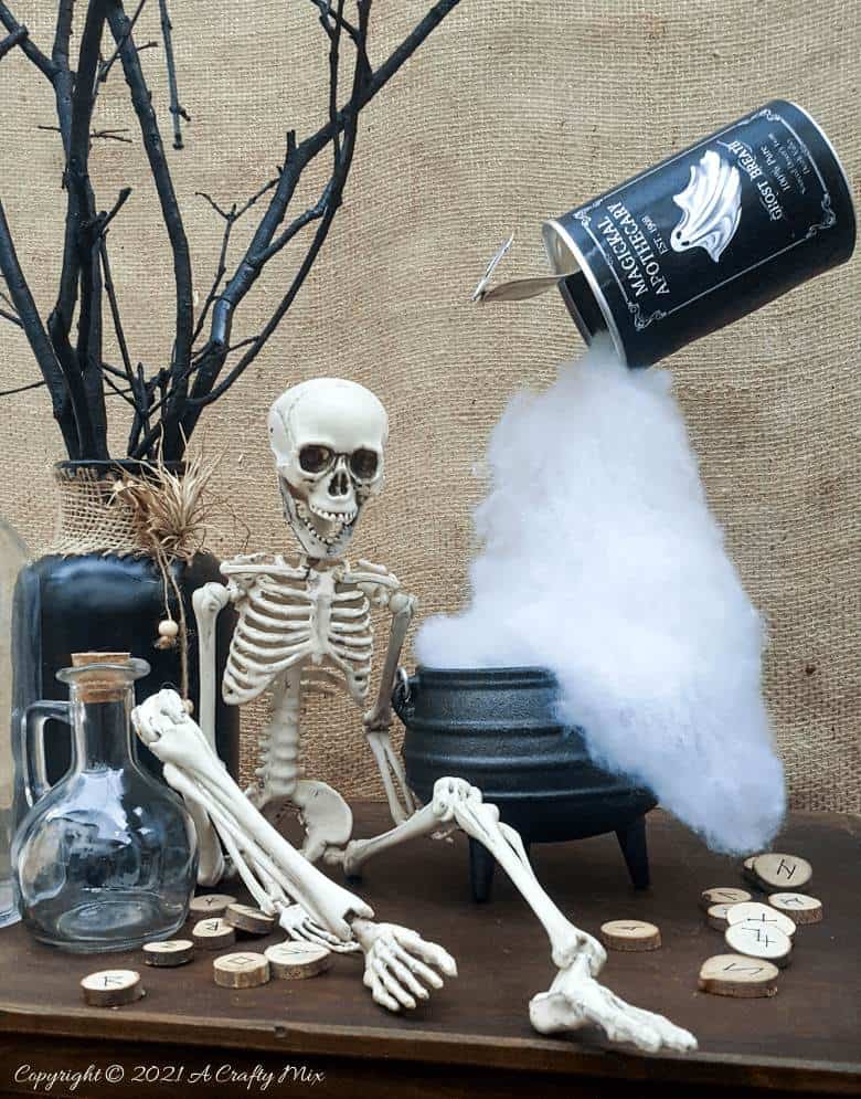 Add a little fun and mystery to your Halloween decor with this easy-to-make magical floating tin can filled with ghost breath. You don't need any special tools and it takes less than an hour to make too. #HalloweenDecor #HalloweenCrafts #ACraftyMix #FloatingTinCan