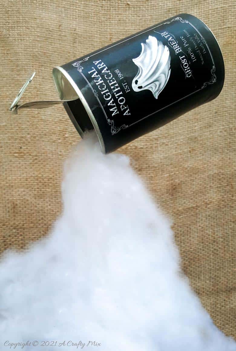 Add a little fun and mystery to your Halloween decor with this easy-to-make magical floating tin can filled with ghost breath. You don't need any special tools and it takes less than an hour to make too. #HalloweenDecor #HalloweenCrafts #ACraftyMix #FloatingTinCan