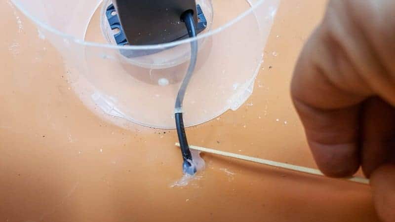 Seal the hole for the plug with silicone glue