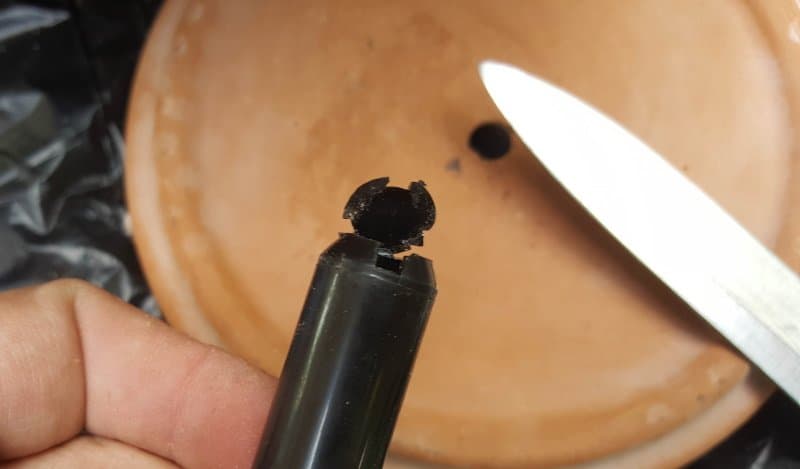 Remove the top of the spindle with a sharp knife