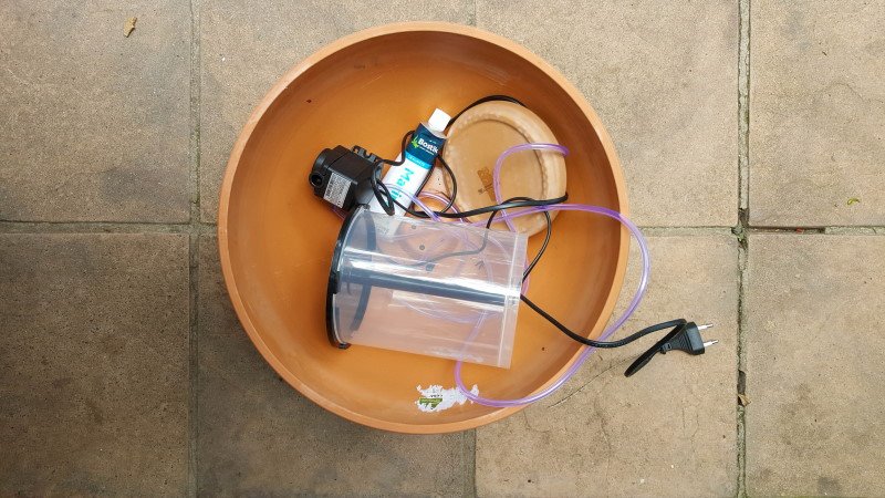 What you need to repurpose a en empty CD spindle case into a water feature