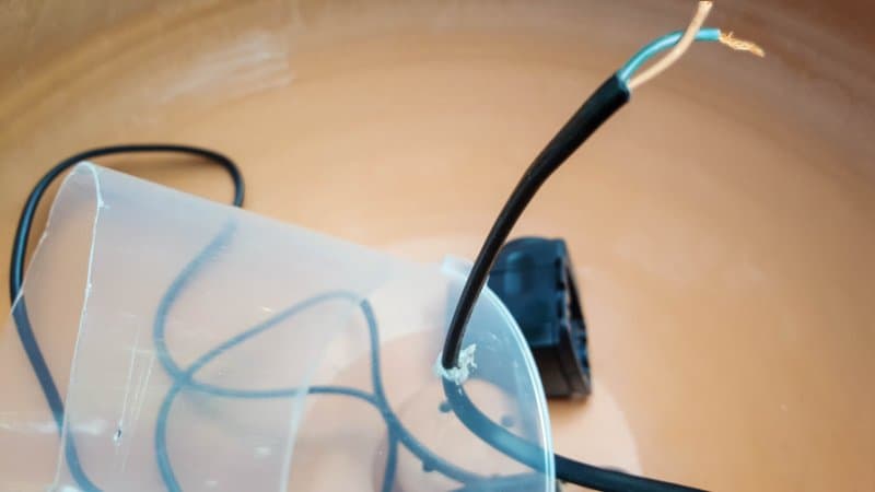 A view from the top showing how the pump fits inside the CD case with the spindle placed on top