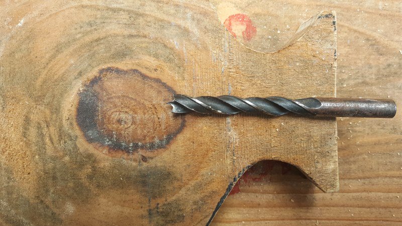 Drill a hole down into the center of the vase shape
