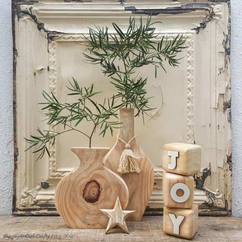If you want to try your hand at using a jigsaw then this beginner friendly tutorial will show you just how easy it is to make a gorgeous wooden vase. Perfect home décor no matter what your style. #jigsawDIY #ACraftyMix #Woodenvase
