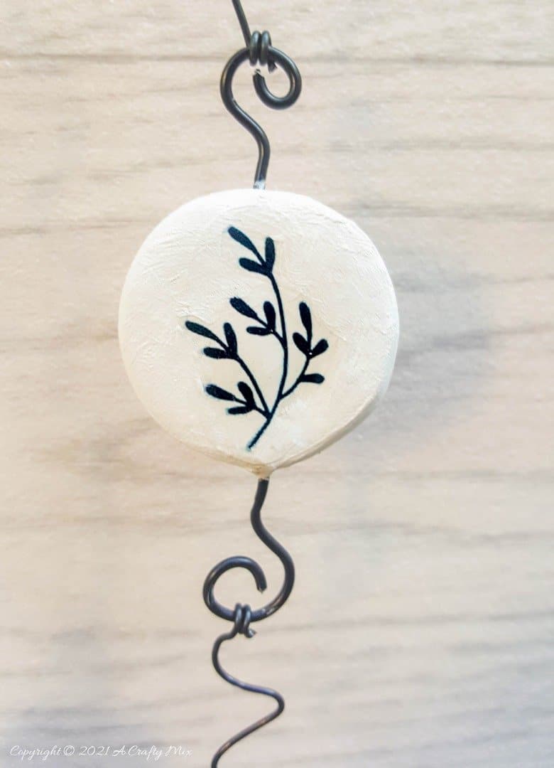 Easy budget friendly tattooed clay wall hanging that can be made in a morning. The photo rich tutorial includes free botanical printables to get you started. #WallDecor #ACraftyMix #AirDryClay