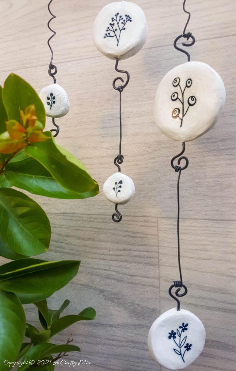 Easy budget friendly tattooed clay wall hanging that can be made in a morning. The photo rich tutorial includes free botanical printables to get you started. #WallDecor #ACraftyMix #AirDryClay