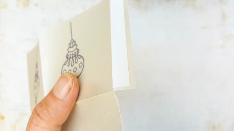 Use double-sided tape or glue to join the sides together