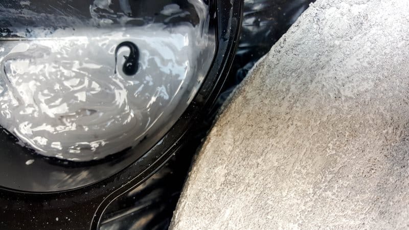 Mix a batch of dark grey craft paint and dry brush it on