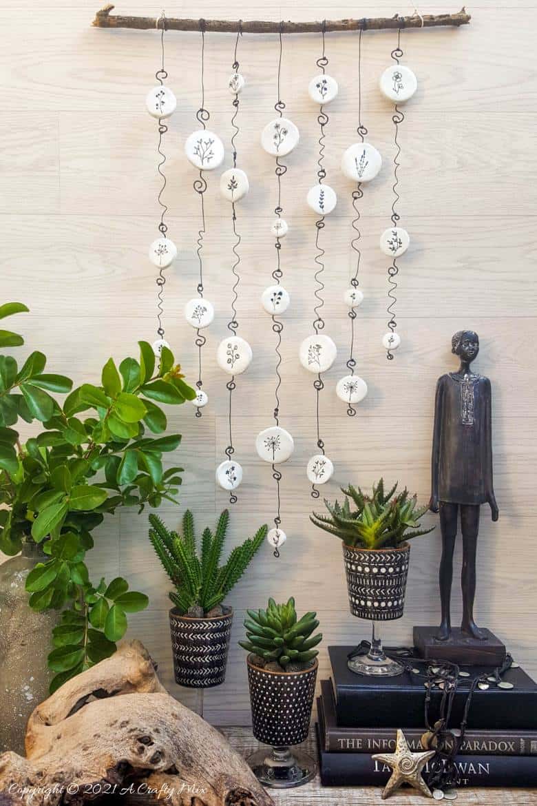 Easy budget friendly tattooed clay wall hanging that can be made in a morning. The photo rich tutorial includes free botanical printables to get you started. #WallDecor #ACraftyMix #AirDryClay