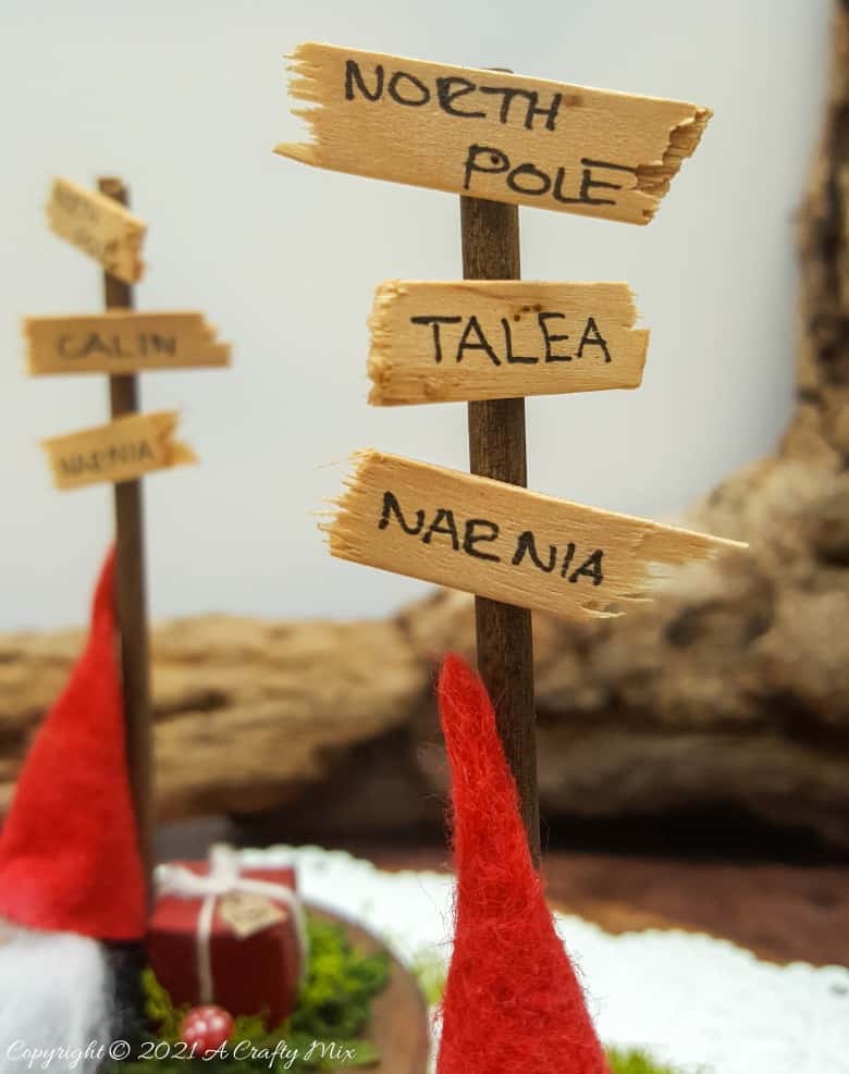 Easy 10-minute no-sew miniature sock gnome that anyone can make! Use these adorable little guys to make Christmas place card holders that your guests can take home as gifts afterwards. #sockgnome #ACraftyMix #giftideas #tomte