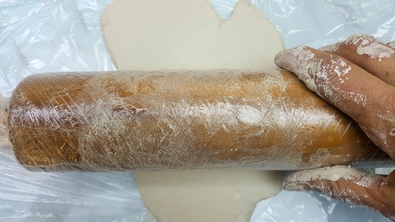 Use a rolling pin to flatten the air=-dry clay out