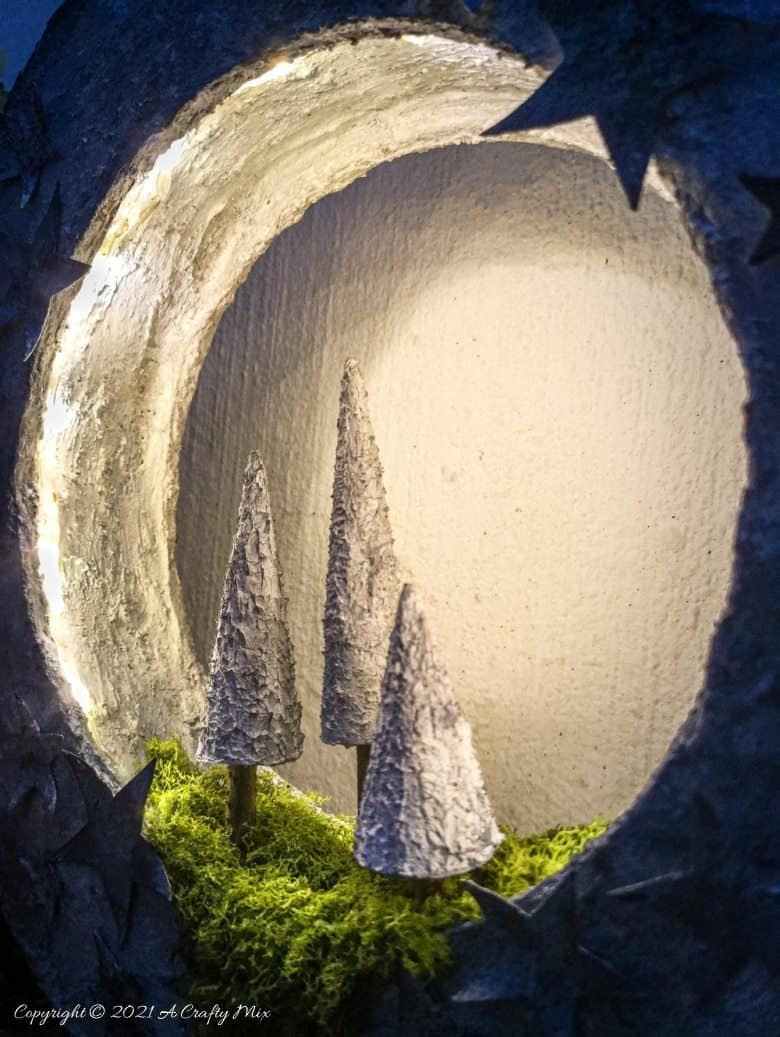 I&rsquo;m in love with how this DIY faux concrete light ring turned out. And no-one believes me when I tell them it's made almost entirely from a repurposed cardboard box. Easy budget-friendly decor that looks amazing. #cardboard #ACaftyMix #Homedecor