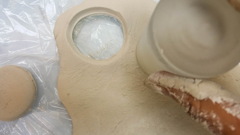 Use a collection of different sized glasses to cut the clay into circles