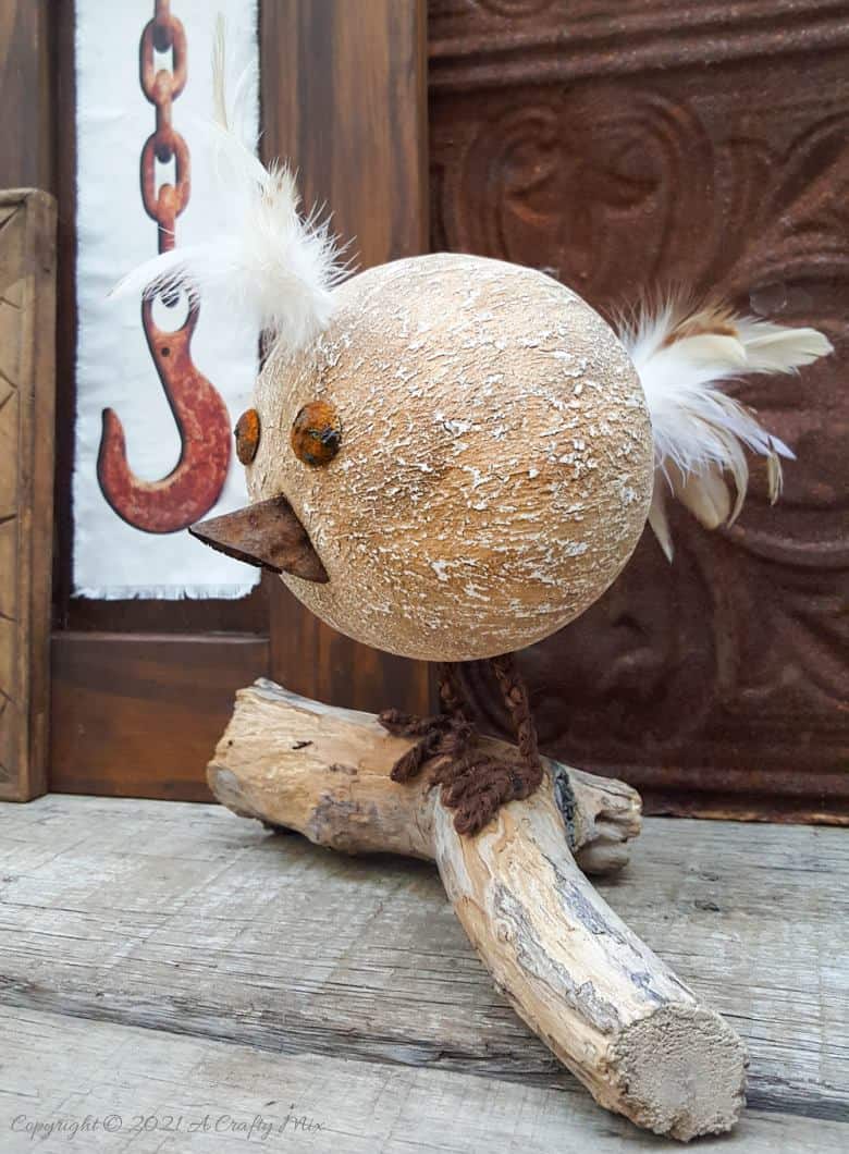 Looking for a budget-friendly craft idea? Then you'll love making this easy polystyrene ball bird with rusty detail. The tutorial will also show you how to mix up a batch of texture paste using common household items. #polystyreneballcraft #ACraftyMix #TexturePaste