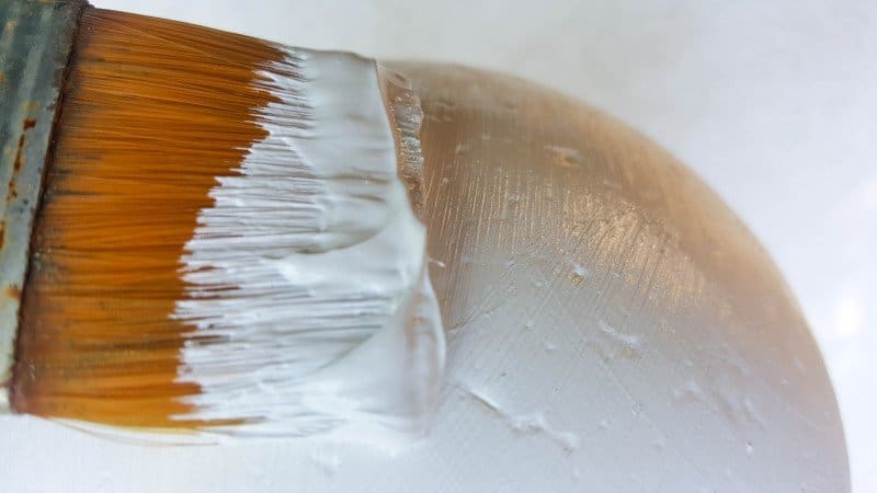 Paint the polystyrene ball to provide a protective coating.