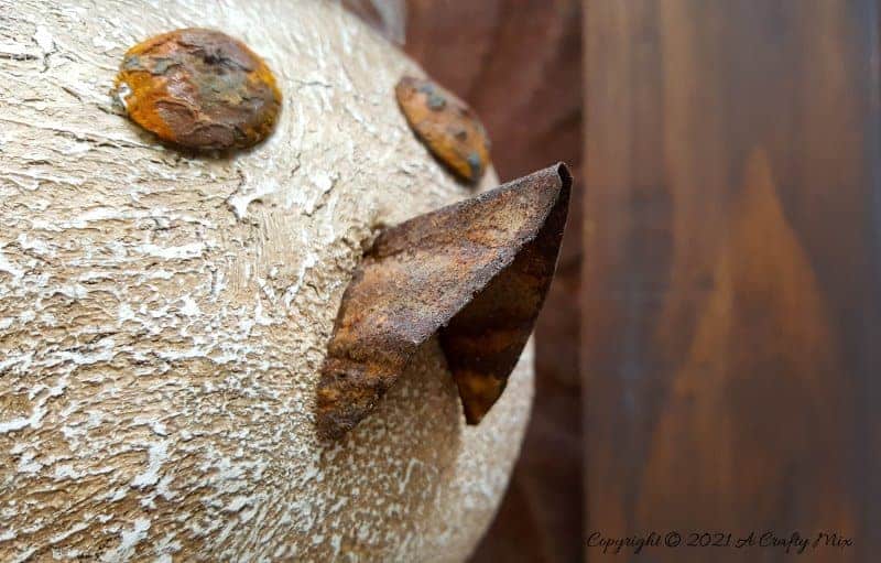 Looking for a budget-friendly craft idea? Then you'll love making this easy polystyrene ball bird with rusty detail. The tutorial will also show you how to mix up a batch of texture paste using common household items. #polystyreneballcraft #ACraftyMix #TexturePaste