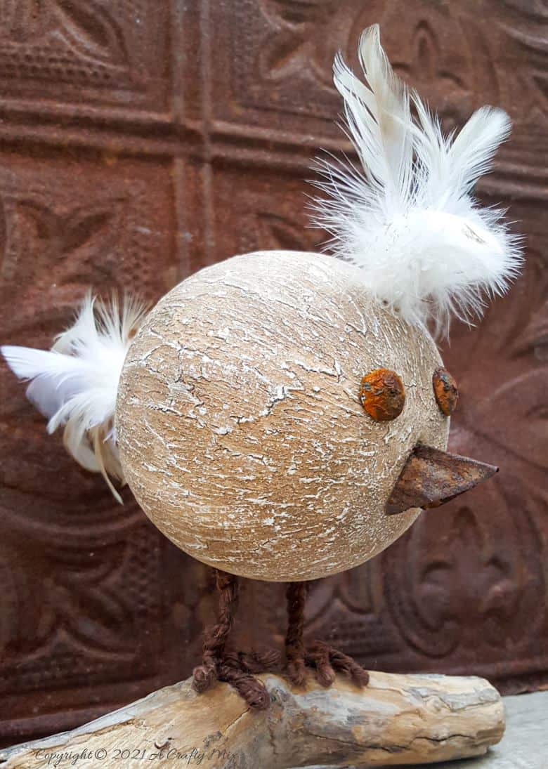 Looking for a budget-friendly craft idea? Then you'll love making this easy polystyrene ball bird with rusty detail. The tutorial will also show you how to mix up a batch of texture paste using common household items. #polystyreneballcraft #ACraftyMix #TexturePaste