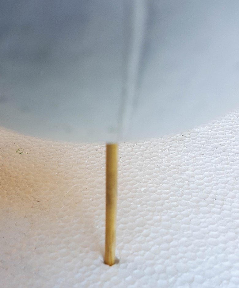 Stab a skewer through the polystyrene ball and place it on another piece of scrap polystyrene to make painting easier