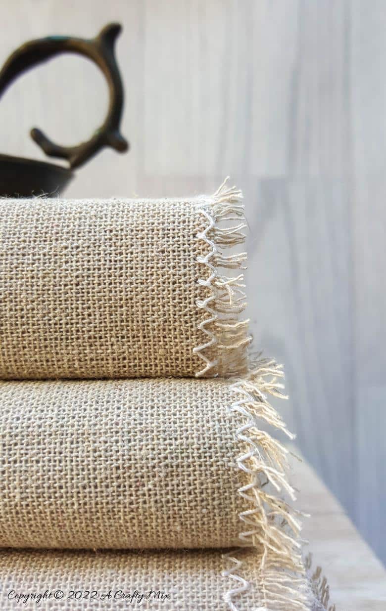 Do you like making a stylish statement while indulging your reading obsession? Then you&rsquo;re going to love these easy to make linen book covers with metal tags. Not only can you dress up your old or new books up in new attire, but you can customise the tutorial to suit your d&eacute;cor style. #DIYBookCovers #ACraftyMix #StylishBooks