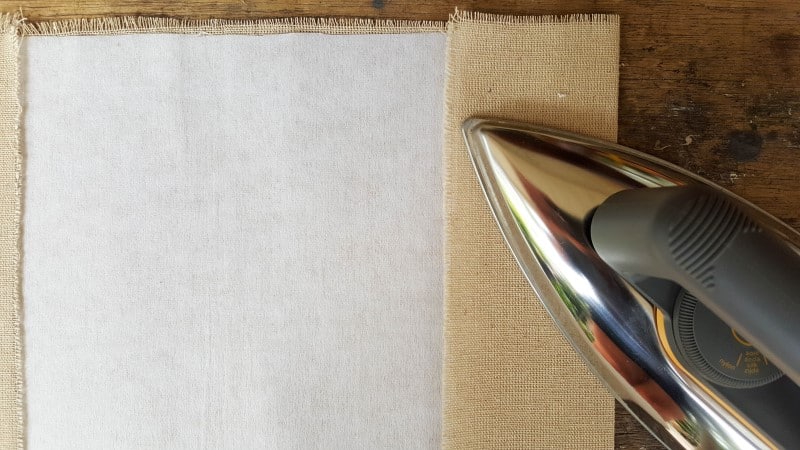 Iron the edges flat to get a neat crisp line